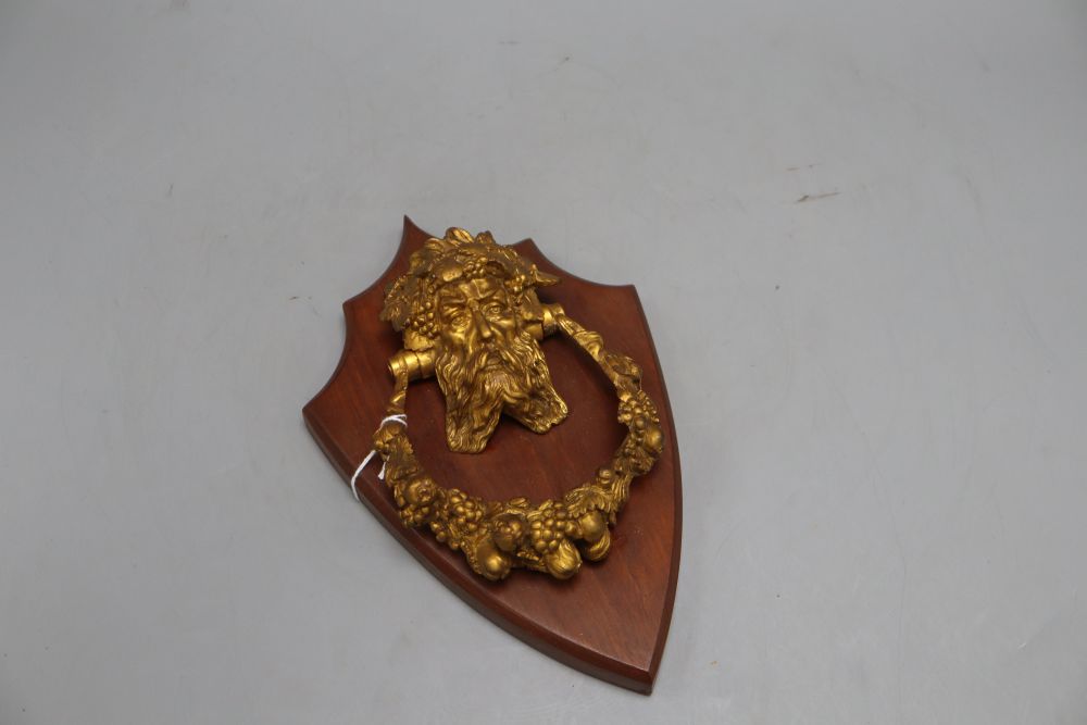 A 19th century Bacchus ormolu door knocker, on shield mount